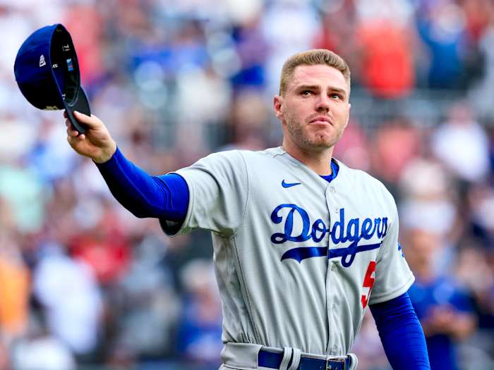 Los Angeles Dodgers first baseman Freddie Freeman walks to the field for the presentation of his World Series championship ring, before the team’s baseball game against the Atlanta Braves on Friday, June 24, 2022 in Atlanta.